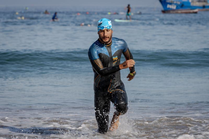 Triathlete running in tri suit